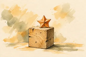 A worn practice block topped with a small orange paper star.